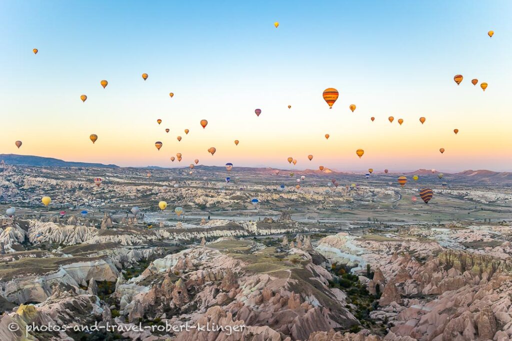 Many hot air ballons over Cappadocia very early in the morning