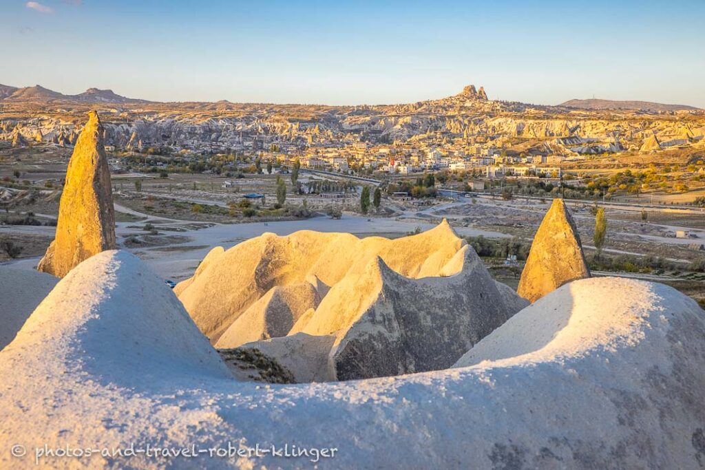 Rockformations in Cappadocia and the city of Göreme in the background Turkey