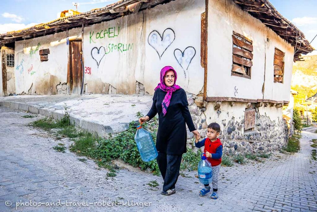 A mother and her little son on the way to the spring to get water in Korgun, Turkey