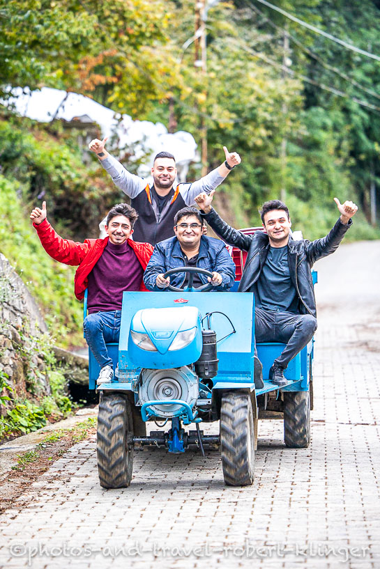 Four men sitting on a little tractor in Turkey
