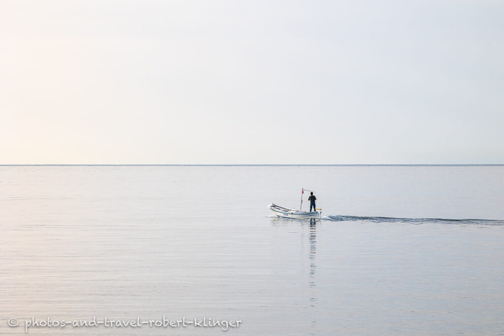 A fisherman leaving the harbour of Amasra with his boat