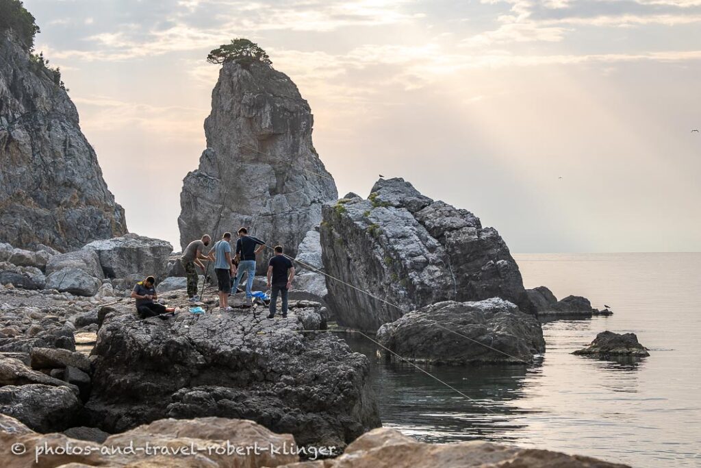 A few fishermen fishing with rods and bait in the Black Sea, Amasra, Turkey