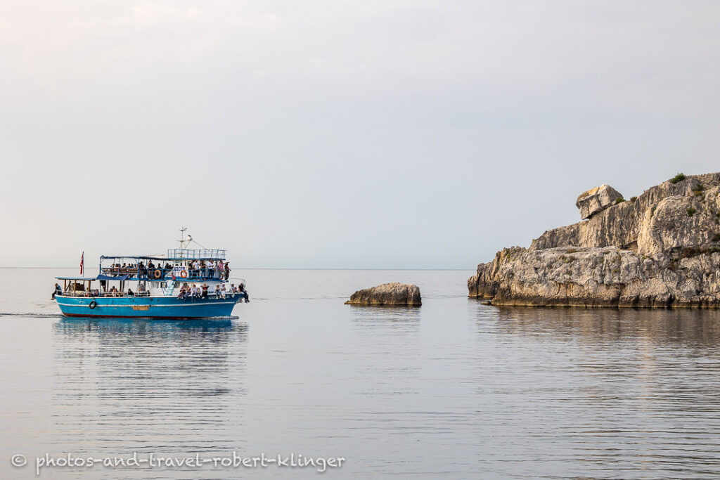 A tourist boat returning into the harbour of Amasra, Turkey