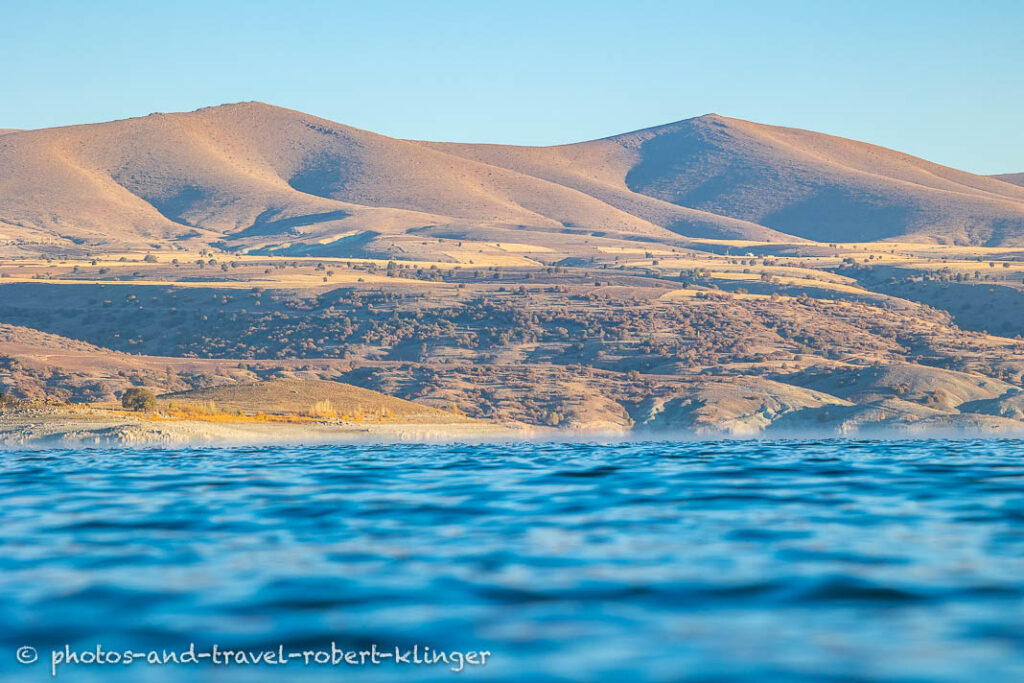 A lake and the early morning sun in eastern Anatolia in Turkey