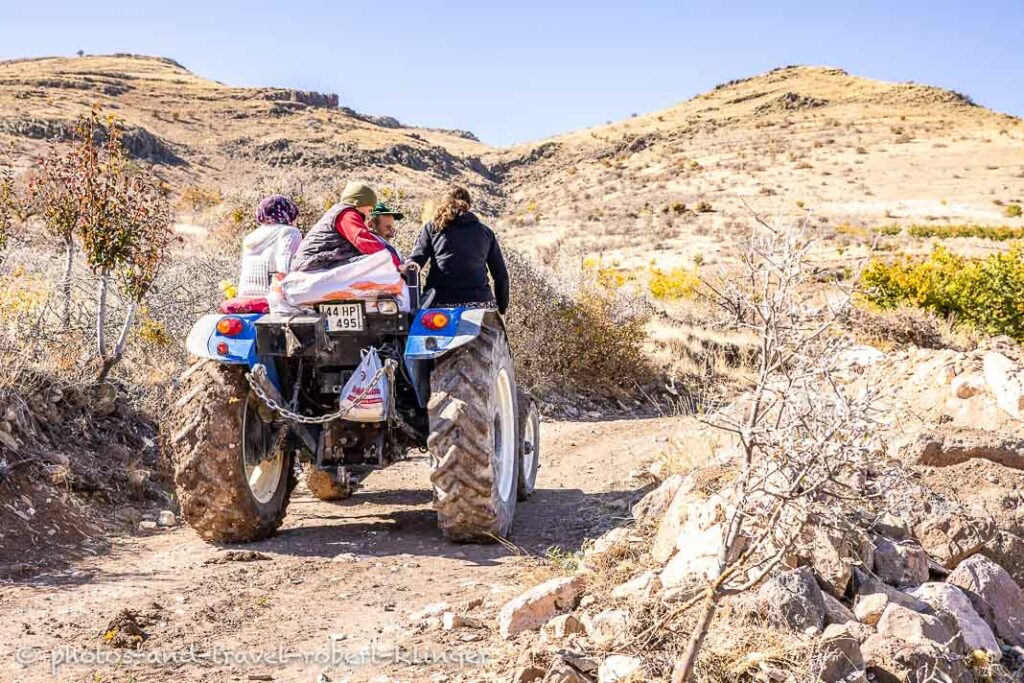 A father and his three children on a tractor in the eastern turkish countryside