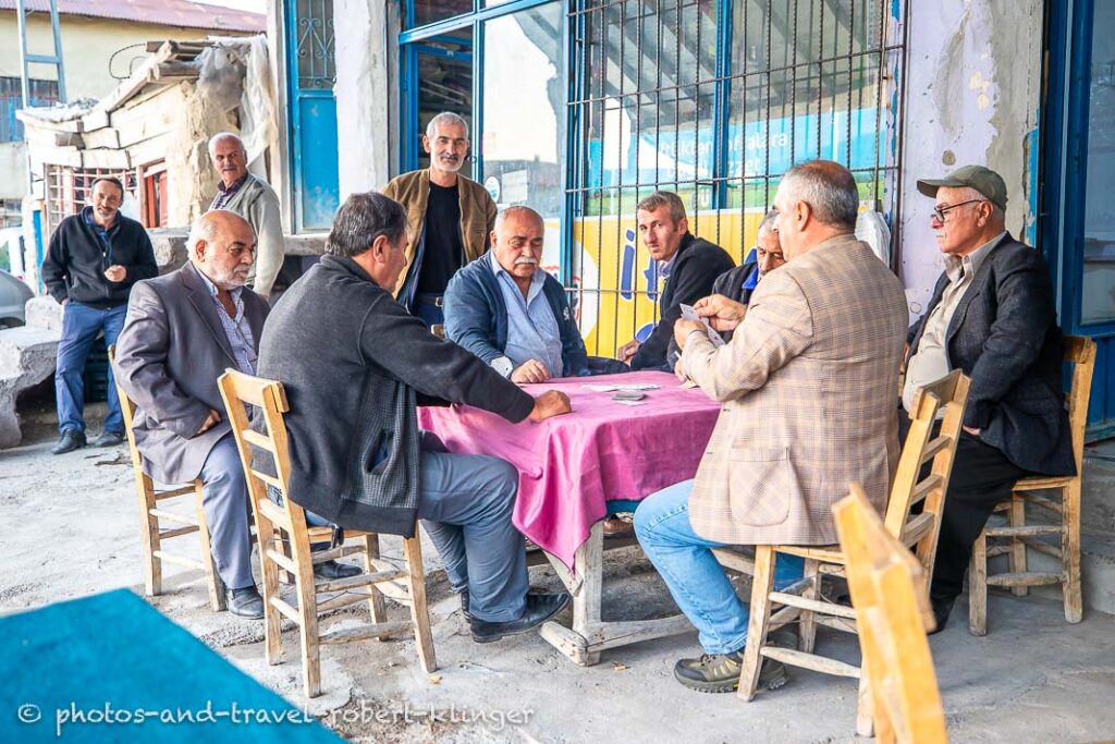 A couple of men sitting in front of a tea room in Asagiulupinar, Eastern Anatolia