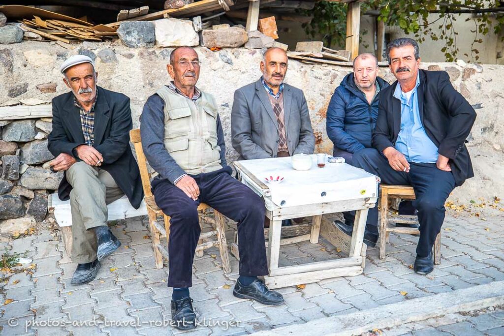 Five men sitting in front of a tearoom in Turkey