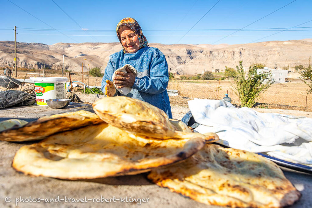 A kurdish woman baking bread in Eastern Turkey