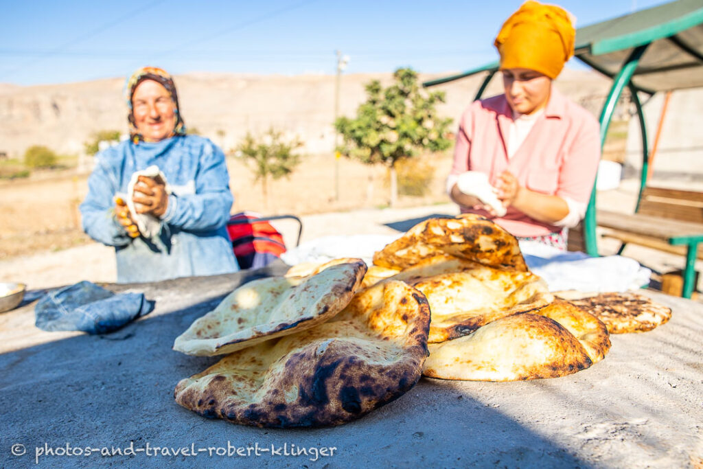 A woman and her doughter baking bread in Kurdistane, Eastern Turkey