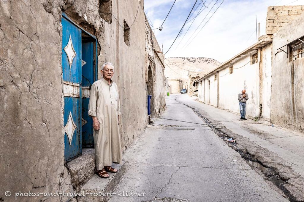 A iraqian man in front of his house in Alqosh