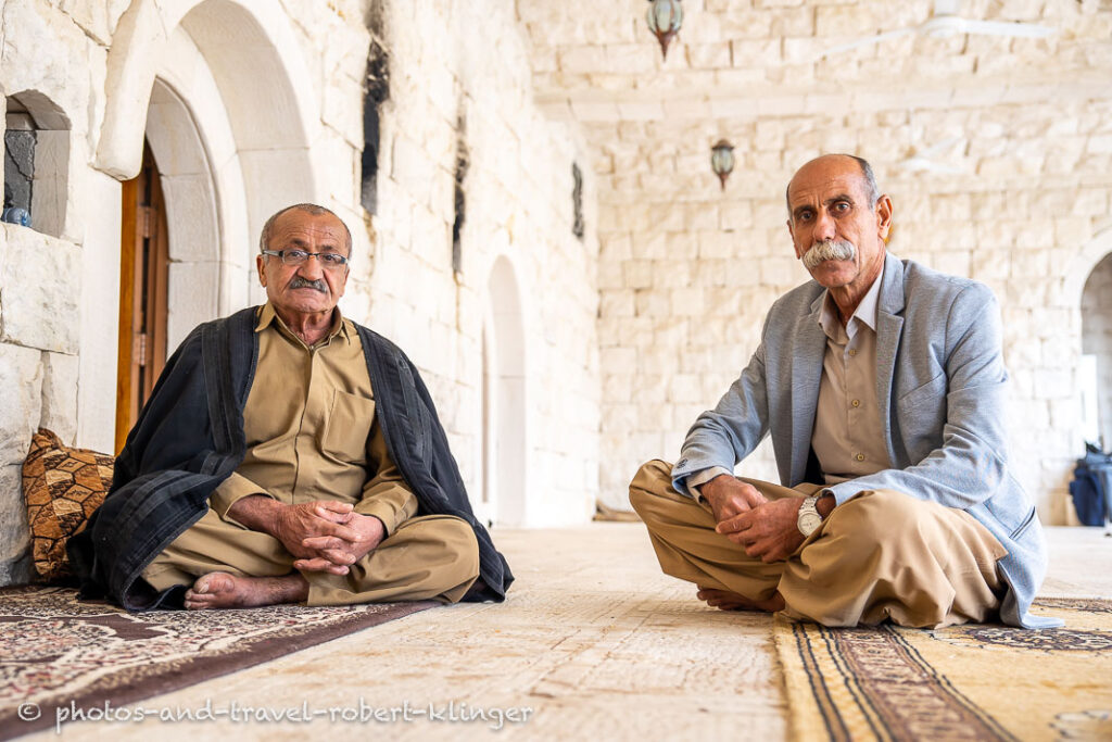 Two men sitting in the temple in Lalish valley