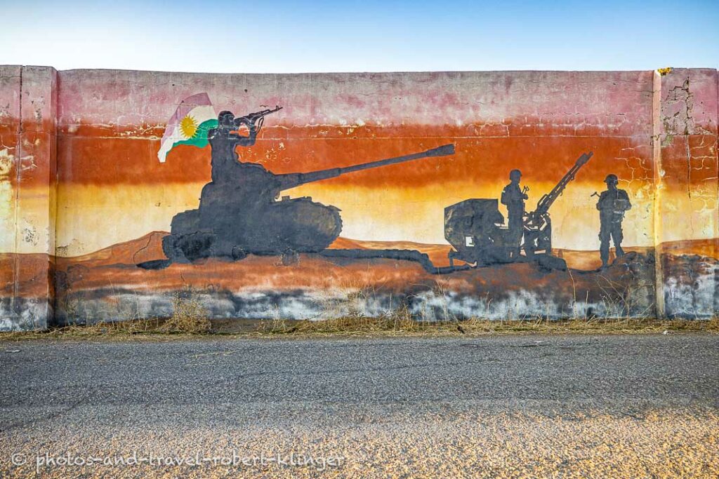 A grafiti with a tank and soldiers in Kurdistane, Iraq