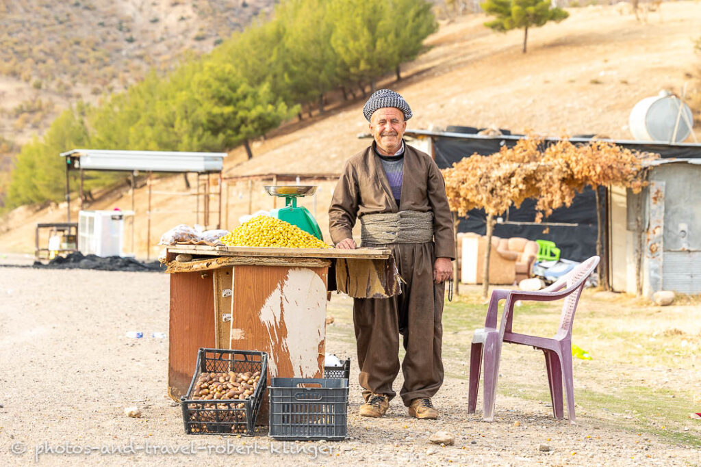 A Kurdish man selling fruits along the road in Iraq