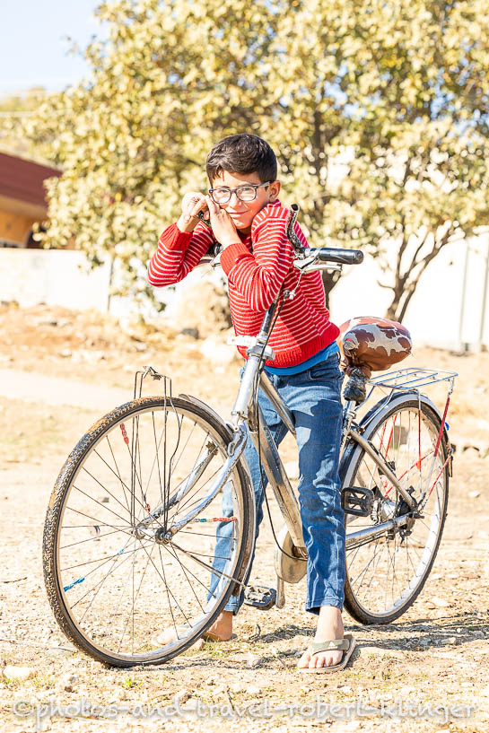 A kurdish boy on a bicycle in Iraq