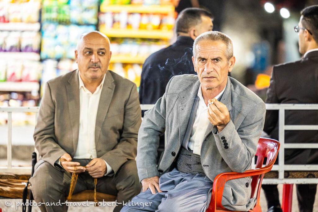 A kurdish man in Akre smoking a cigarette