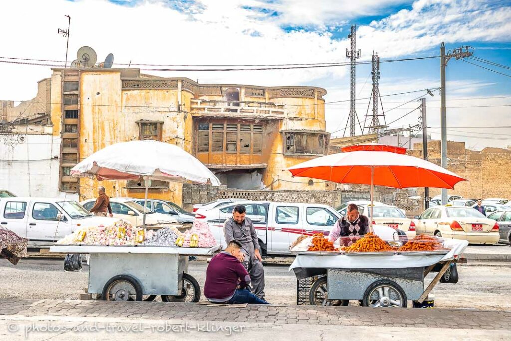 Two men selling goods on the streets of Erbil