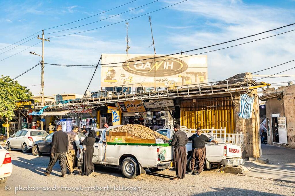 People and a few cars on the streets of Erbil in Kurdistan