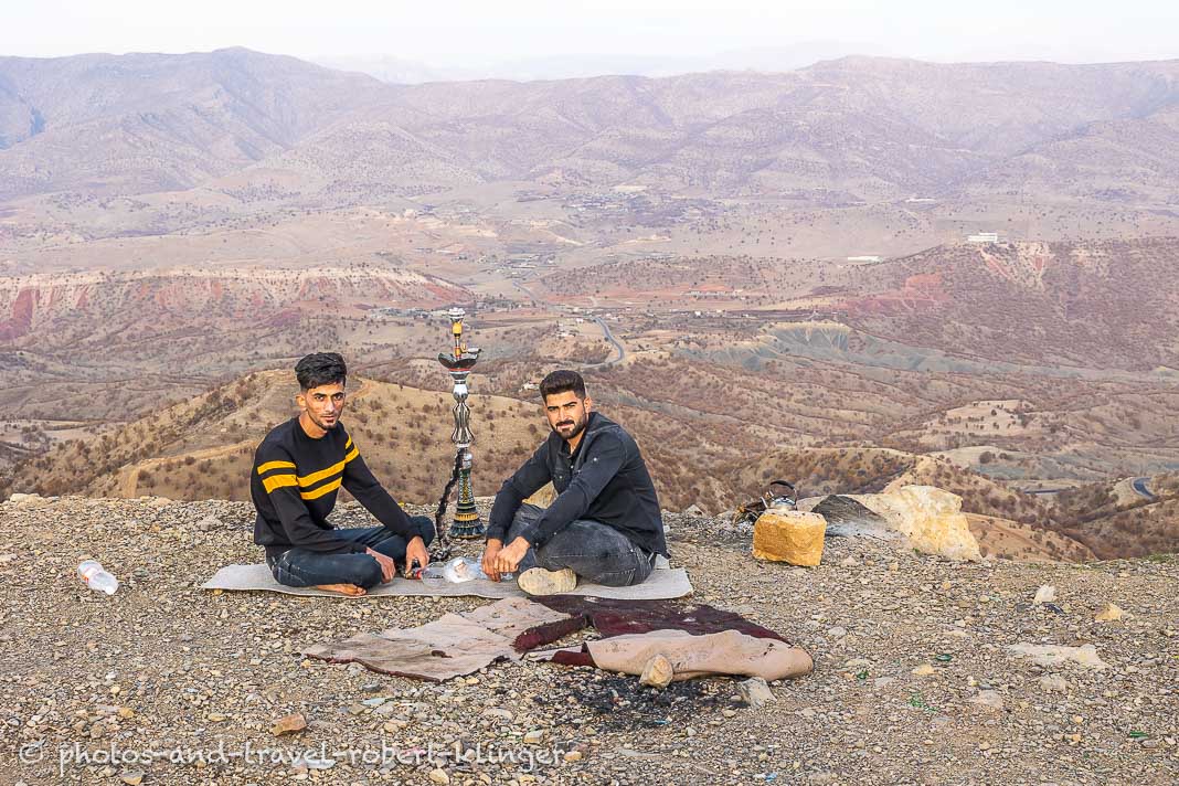 Two iraqi men smoking in the mountains of Kurdistan, Iraq