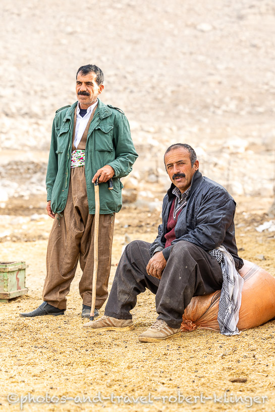 A portrait of two goat farmers in Kurdistan