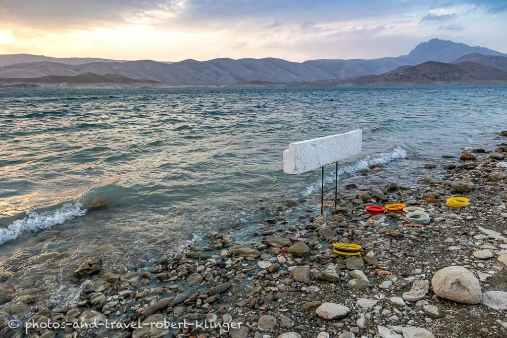 A couple of baits are thrown in Lake Dukan to catch carp