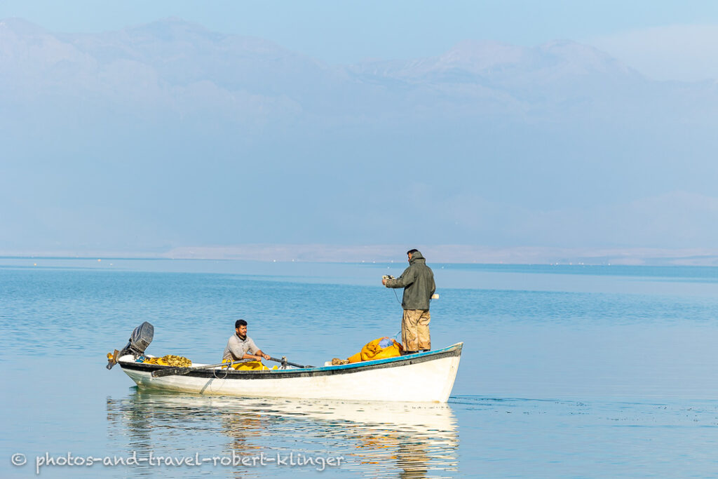 Two fishermen in there boat on Lake Dukan