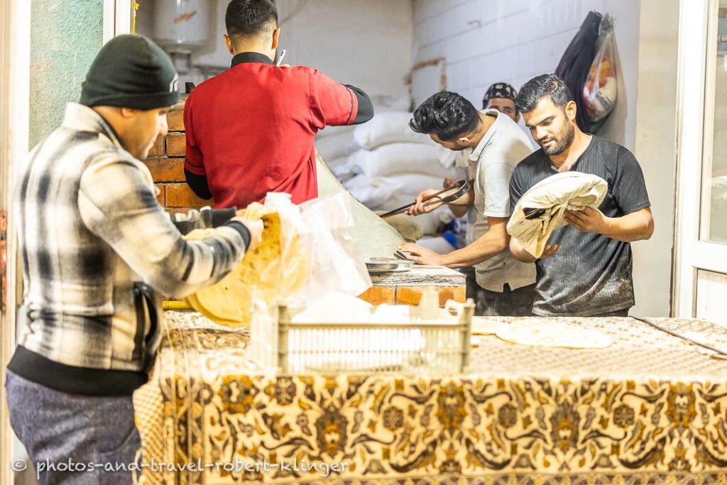 A few kurdish men baking bread in Kurdistane
