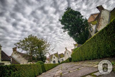 An almshouse at sunset with stunning clouds, Bruges Belgium, photo by Photo Tour Brugge.