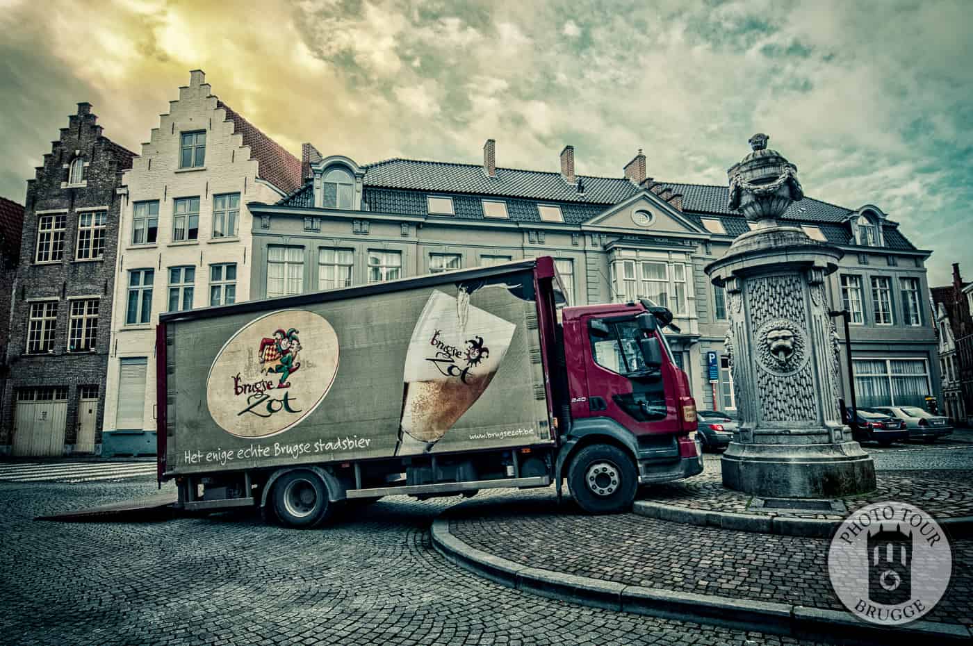 The Brugse Zot delivery van squeezes in somewhere in Bruges Belgium. Photo by Photo Tour Brugge.