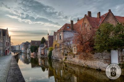 The sky lights up a row of lovely canals and reflections in Bruges Belgium. Photo by Photo Tour Brugge.