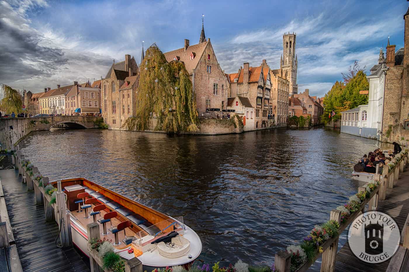 A wide angle shot a boats and the view of the "postcard perfect" Rozenhoedkaai in Bruges Belgium. Photo by Photo Tour Brugge.