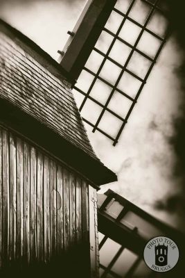 A windmill by the Kruispoort of Bruges Belgium. Photo by Photo Tour Brugge.