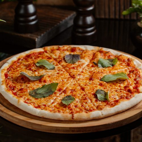 margharita-pizza-with-full-tomato-sauce-andgreen-basilica-leaves-per-slice