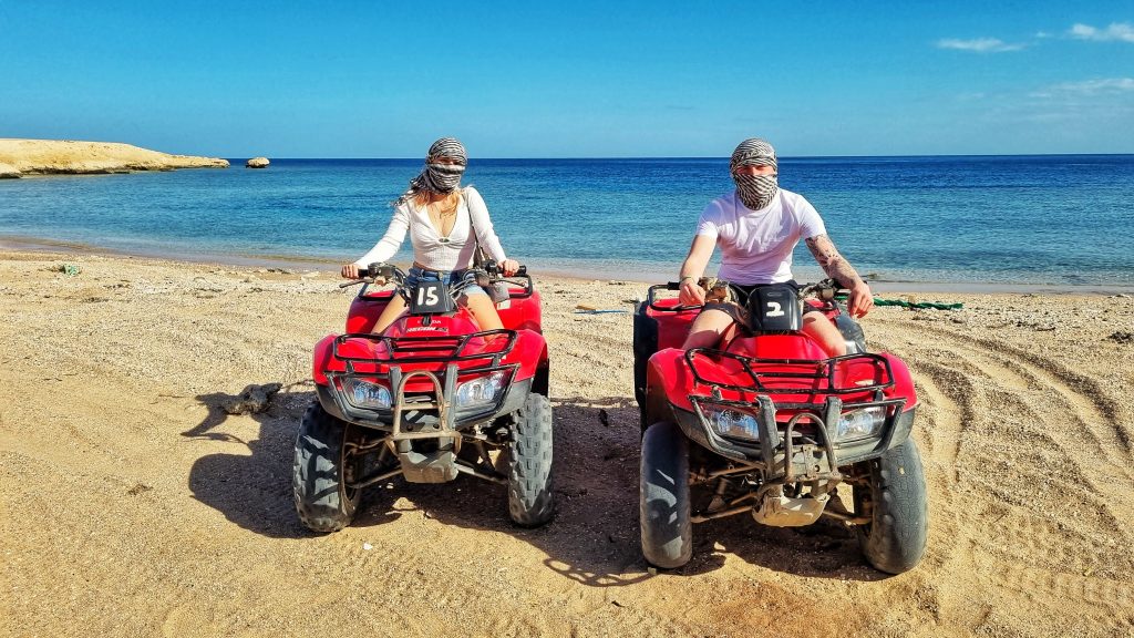 Going on a private quad bike tour is one of the best romantic things to do in Hurghada. This photo is taken of us both on quad bikes enjoying the private beach to ourselves.