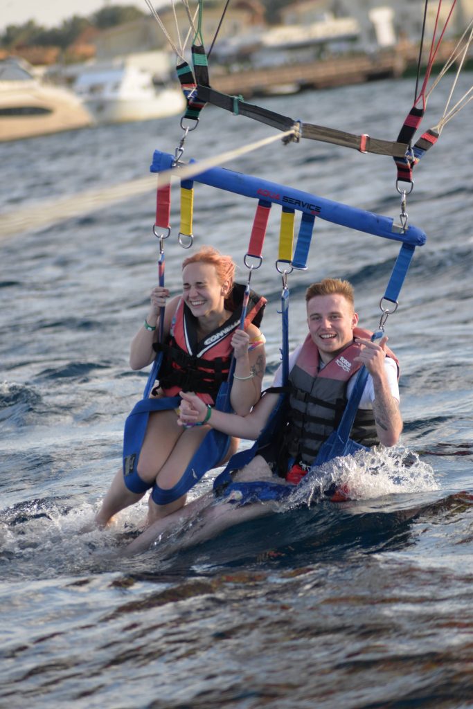 Amy & Liam just going into the water whilst they were parasailing.