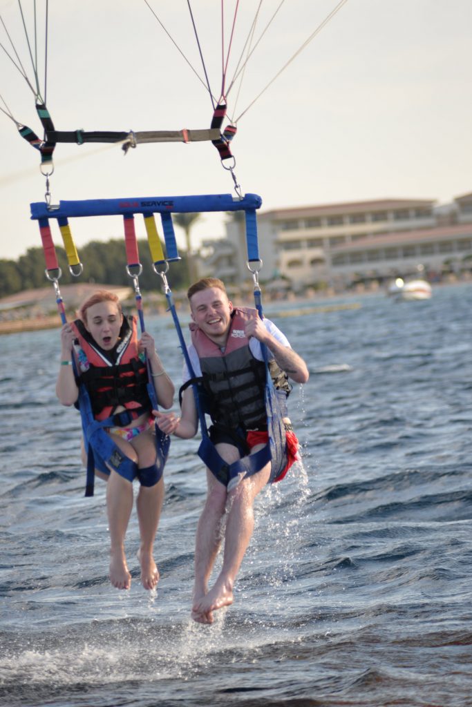 Amy and Liam parasailing in Makadi bay after just being dunked into the water.