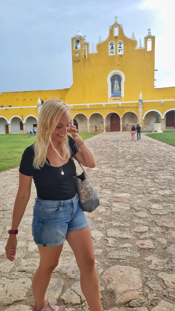 This photo of Amy was taken by a friend that she met on a walking tour in Merida who also had a really good knack for photography. It shows Amy laughing in front of some of the infamous yellow buildings in Izamal.