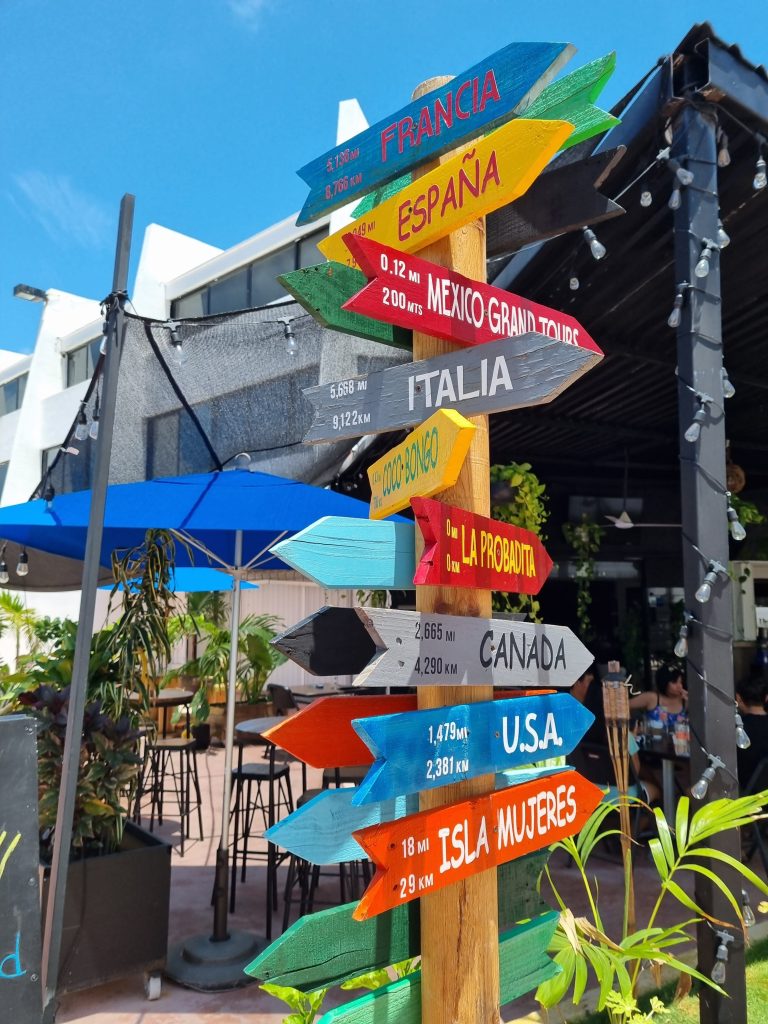 Travelling alone to Mexico is one of the best trips you can do. Absolutely love this sign which shows you how far away different countries and areas of Mexico are.