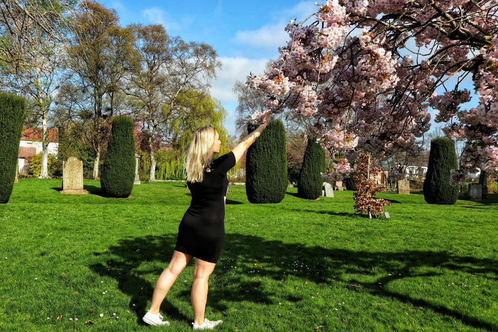 Amy enjoying some of the beautiful blossoms outside St. Mary's Collegiate Church.