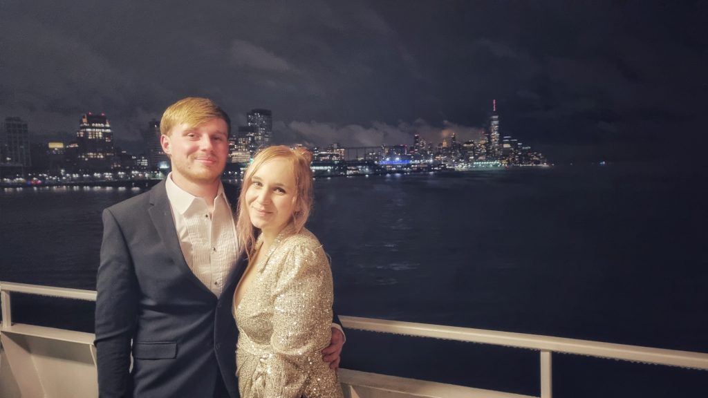 Amy & Liam enjoying the best party for NYE with the beautiful lights of New York City shining behind them.