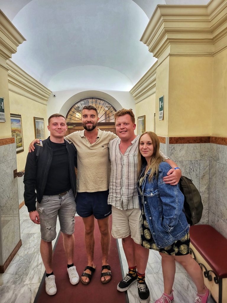 Traveling in hostels is a great way to meet people. This image shows Amy and Liam with two friends that they made from New Zealand.