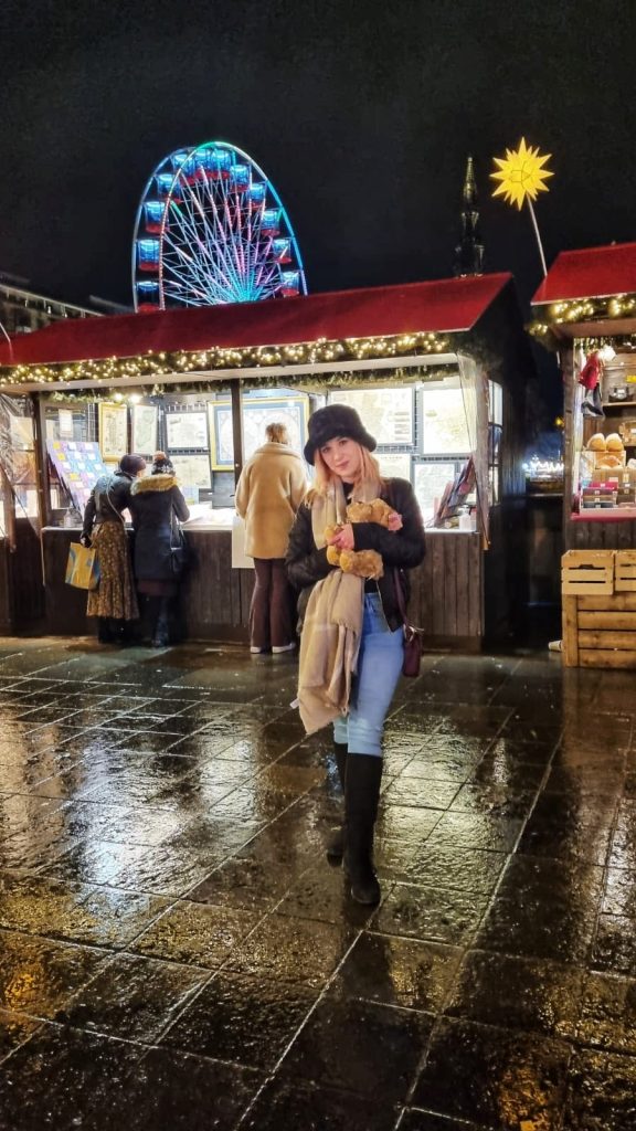Amy enjoying the Christmas Markets in Edinburgh with the teddy they won from some of the games.