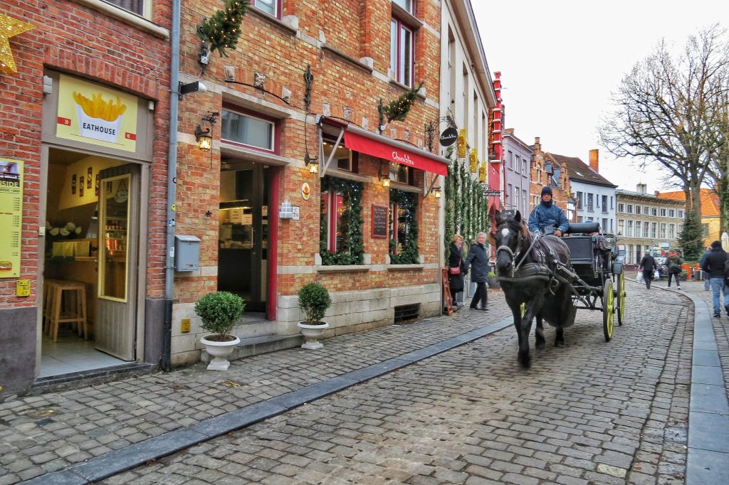 Horse and carriage ride down the streets in Bruges.