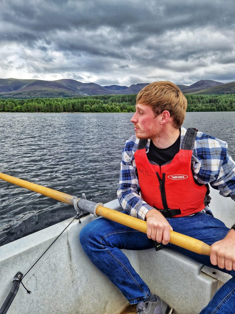 Liam enjoying the views of Lake Morlich on the row boat we rented.