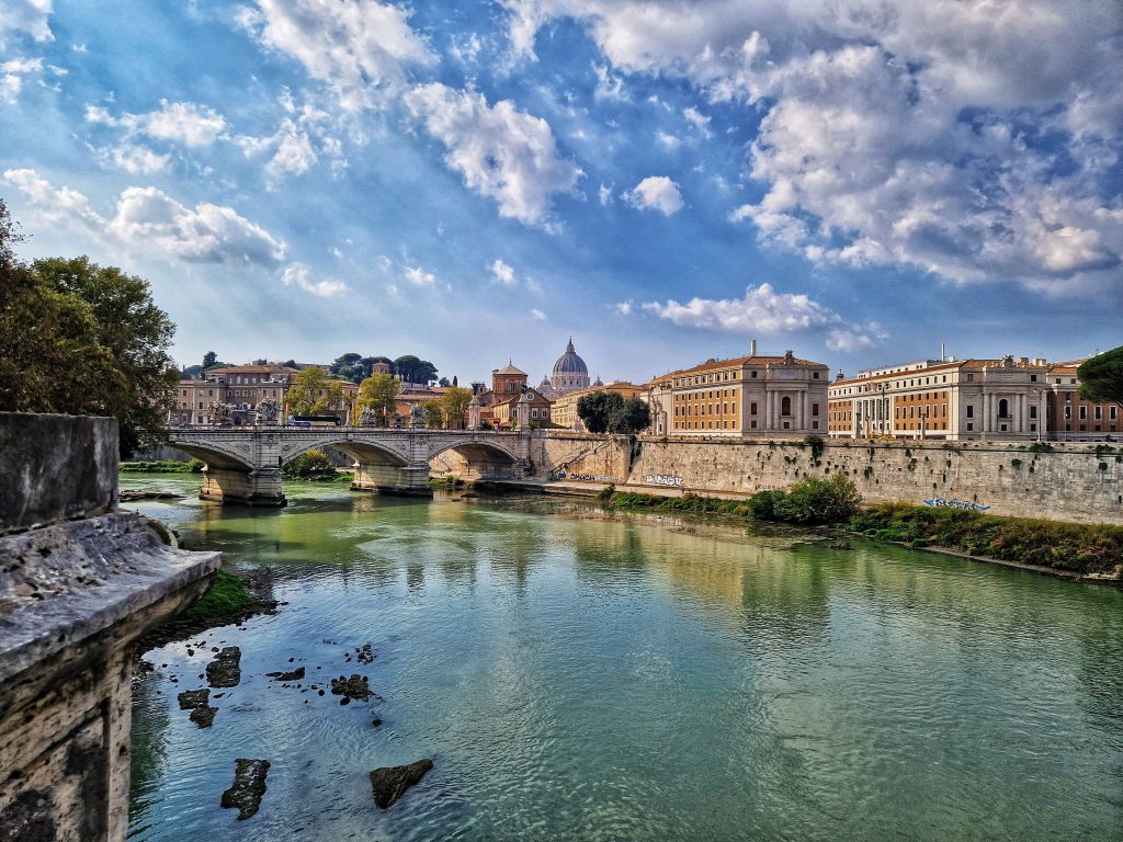 Tiber River where you can view the buildings of Rome in the background.