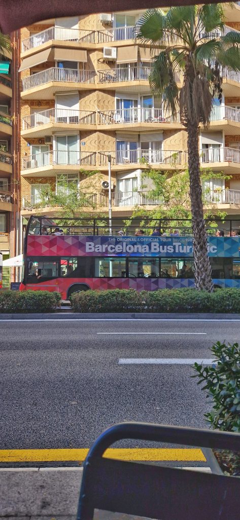 The Barcelona tourist bus passing by.