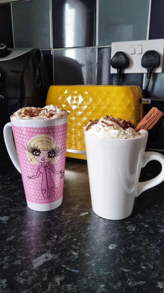 Enjoy a hot chocolate crawl together to spend some time and sample some delicious hot chocolate. This image shows some hot chocolate we made at home on our fake Christmas date. The hot chocolates have flakes, whipped cream and crumbled chocolate on top!