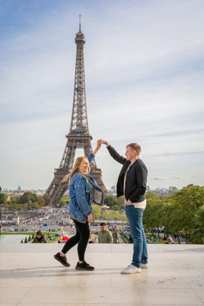 Amy and Liam dancing in front of the Eiffel Tower.