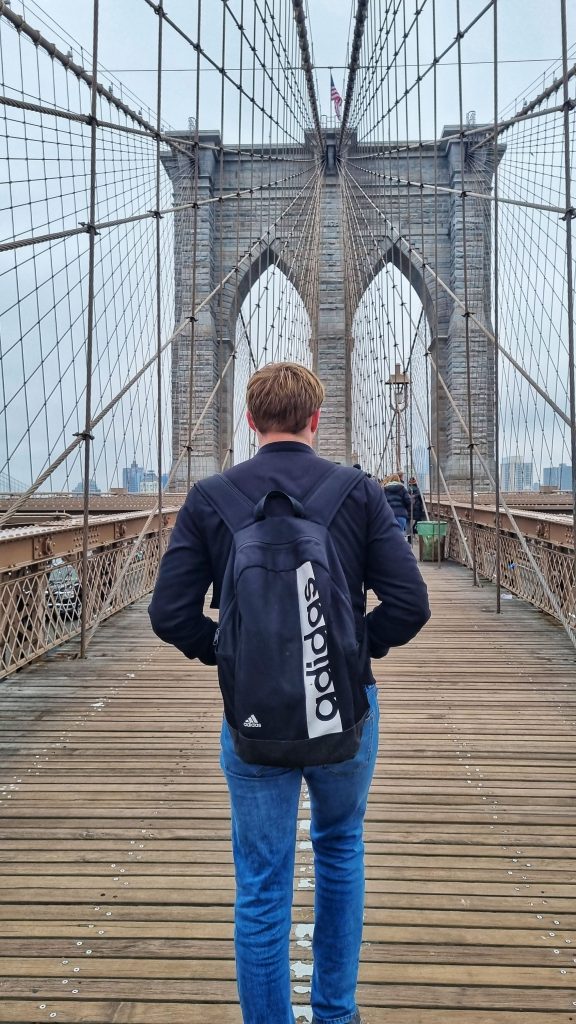 Liam walking on Brooklyn Bridge.