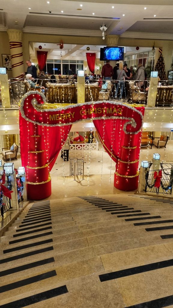 The lobby of Labranda Royal Makadi. You can see beautiful fairy lights set up as we visited during Christmas and a big red curtain with Merry Christmas emblazoned upon it.