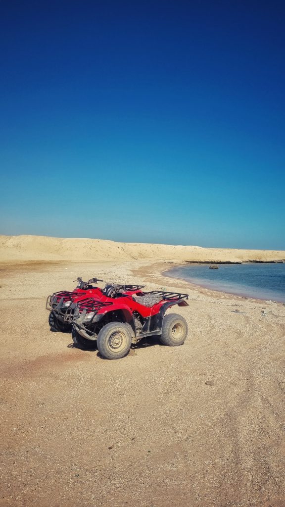 Our quad bikes on this private beach after enjoying our safari through the desert. This is one of the best day trips Hurghada has to offer!